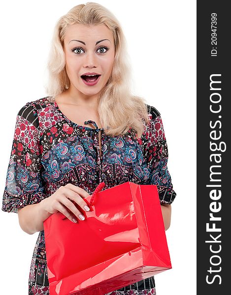 Portrait of a young woman holding a shopping bags over white background. Portrait of a young woman holding a shopping bags over white background