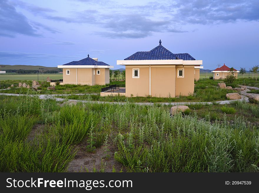 Holiday resort cabins in grassland.