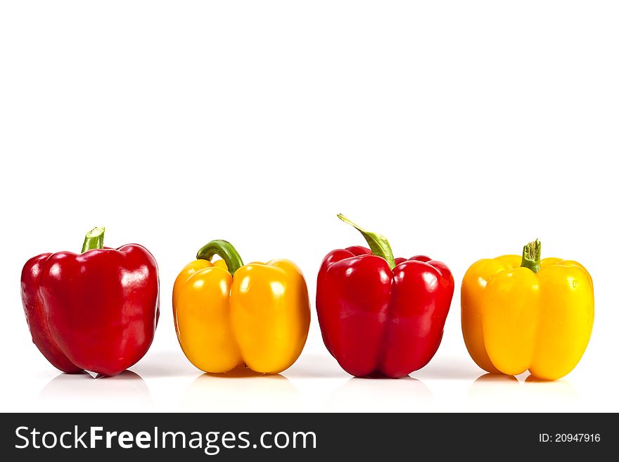 Yellow and red bell pepper on white background with blank text copy space. Yellow and red bell pepper on white background with blank text copy space