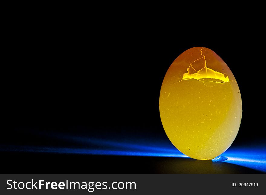 Illuminating an egg by back lighting it. Illuminating an egg by back lighting it