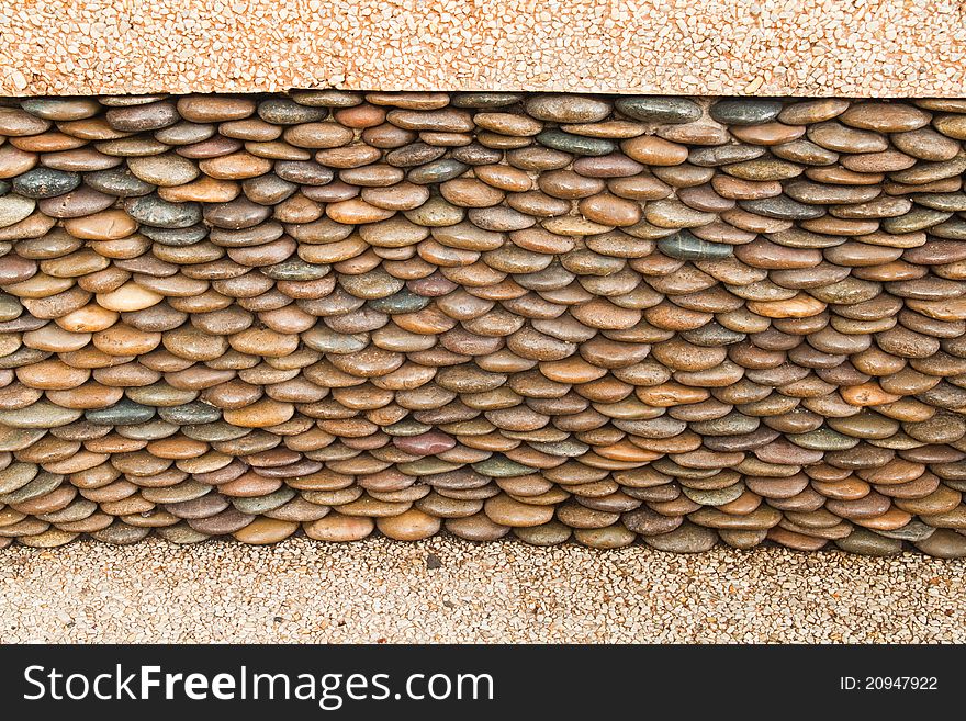 Close up of circle pebble wall,abstract background