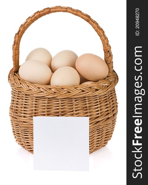 Eggs and basket on white background