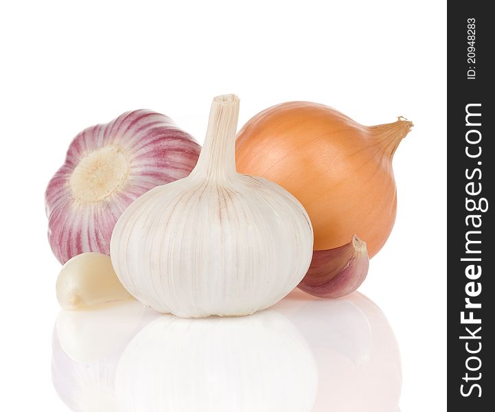 Garlics and onion on white background