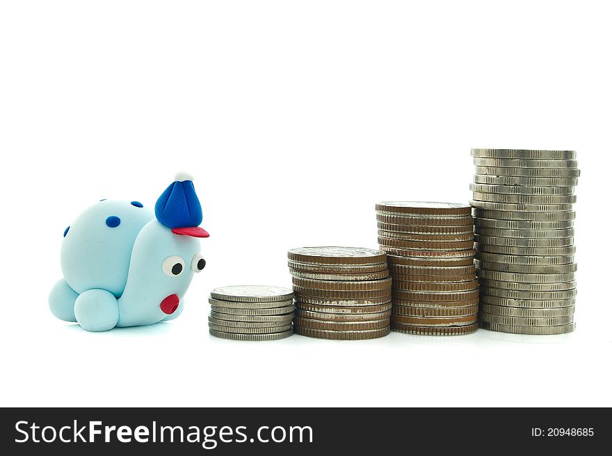 Heap of coins and plasticine turtle for financial planning concept. Heap of coins and plasticine turtle for financial planning concept