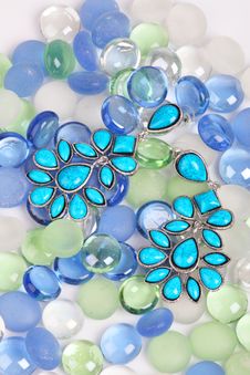 Earrings Against Color Pebbles Stock Photos Earrings Against Color Pebbles Stock Photos