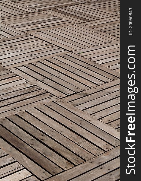 Patterns and textures of a wooden planks pavement