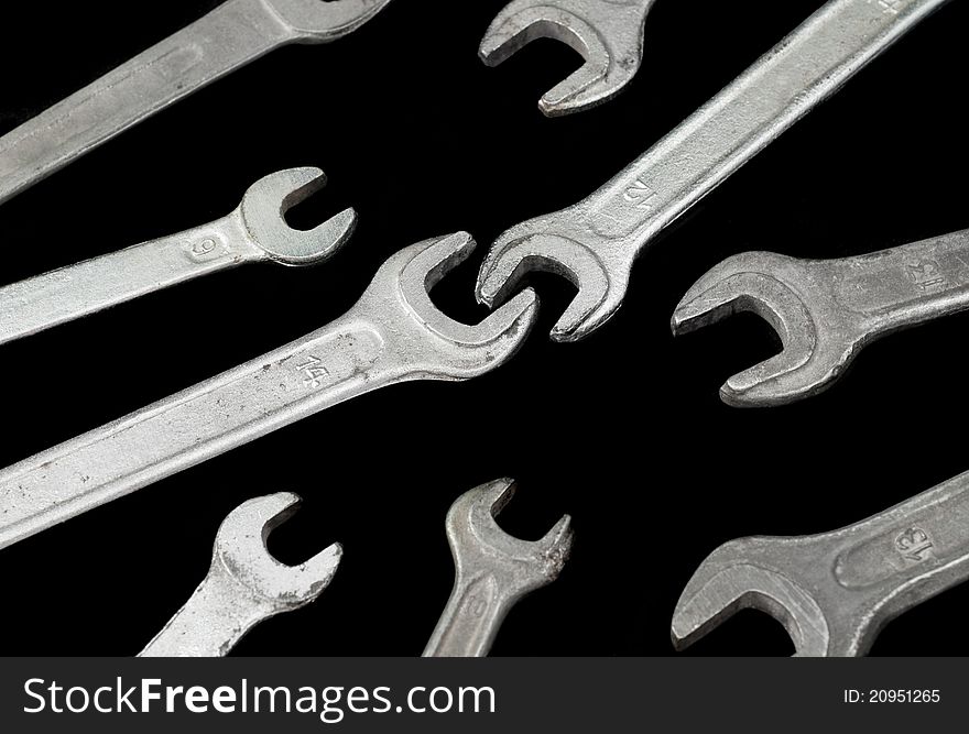 Wrenches on a black background