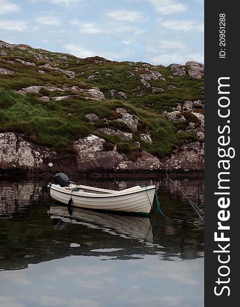 Fishing boat at a bay with scenic view in county kerry ireland. Fishing boat at a bay with scenic view in county kerry ireland