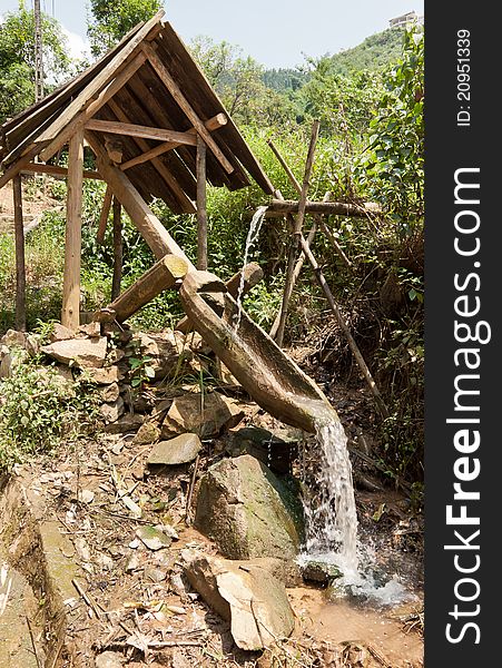 A structure helping to redirect water running from the mountains to bring to rice fields, which is widely used in Sapa, Vietnam. A structure helping to redirect water running from the mountains to bring to rice fields, which is widely used in Sapa, Vietnam.