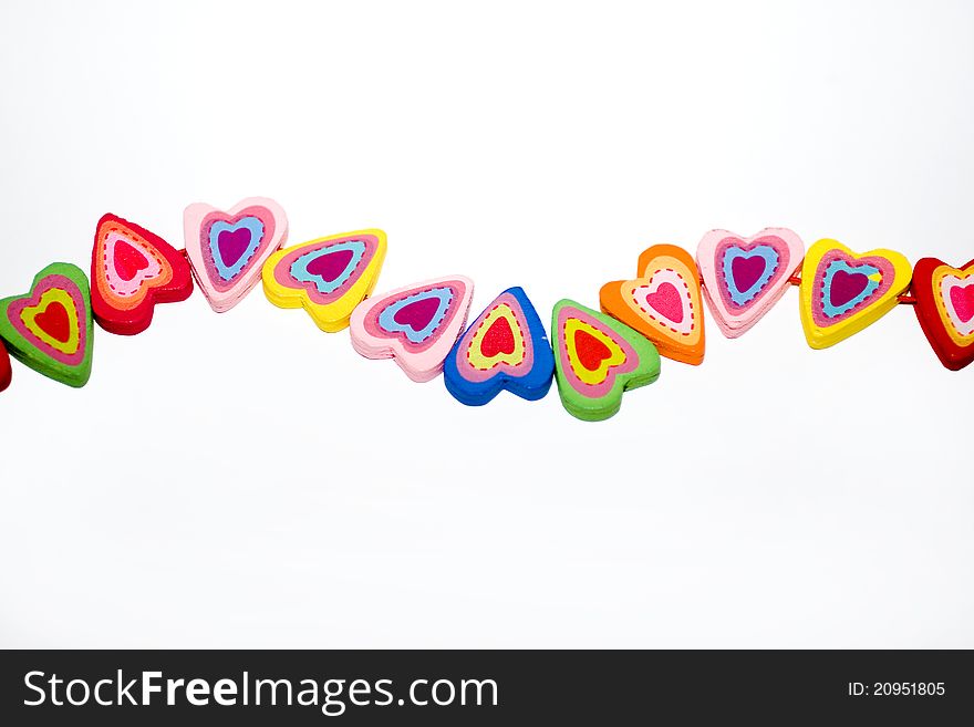 Wooden hearts with colorful elements. Wooden hearts with colorful elements