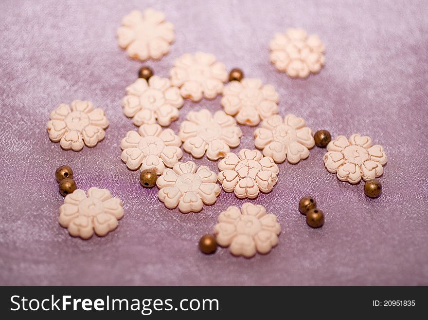 Plastic beads with elements of flowers. Plastic beads with elements of flowers