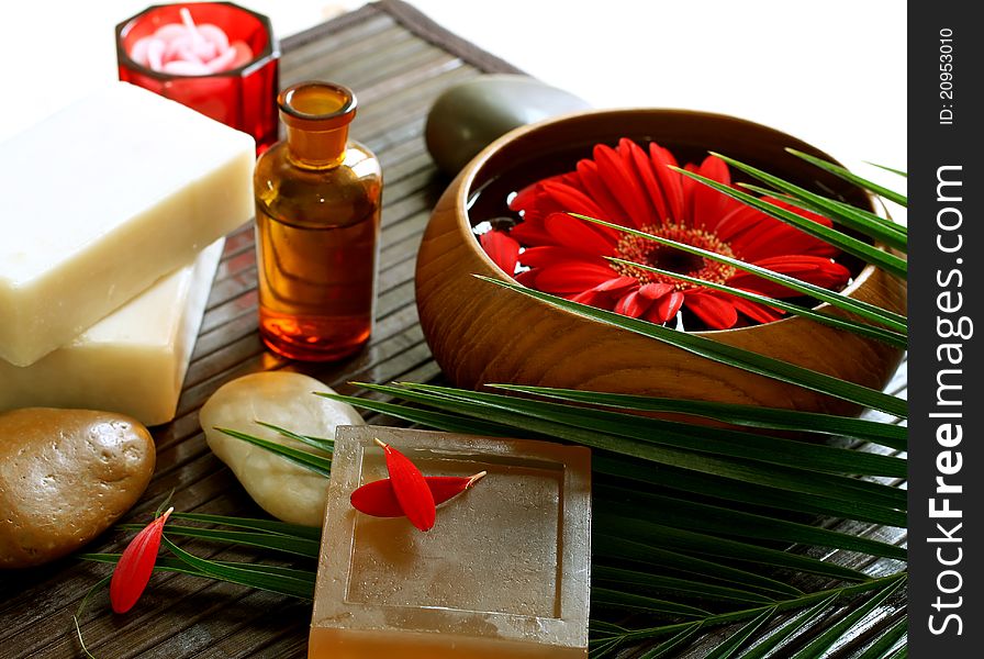 Spa composition of soap, botle, stones and flowers