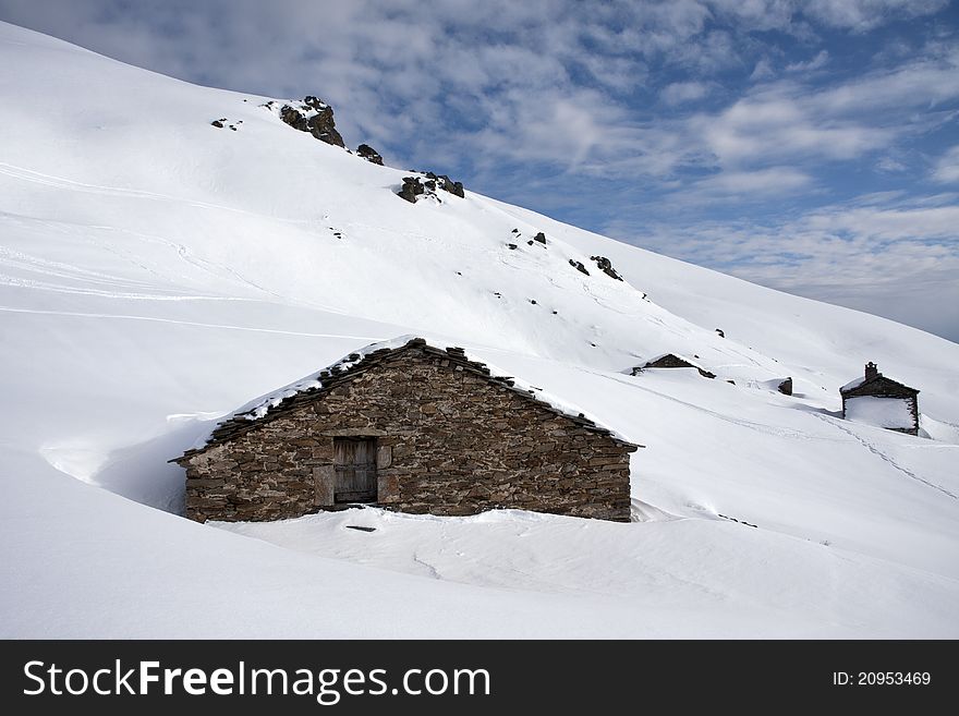 Mountain cabin in the snow in the Alps