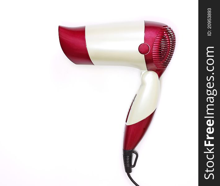 Beautiful red and white hair dryer on a white background