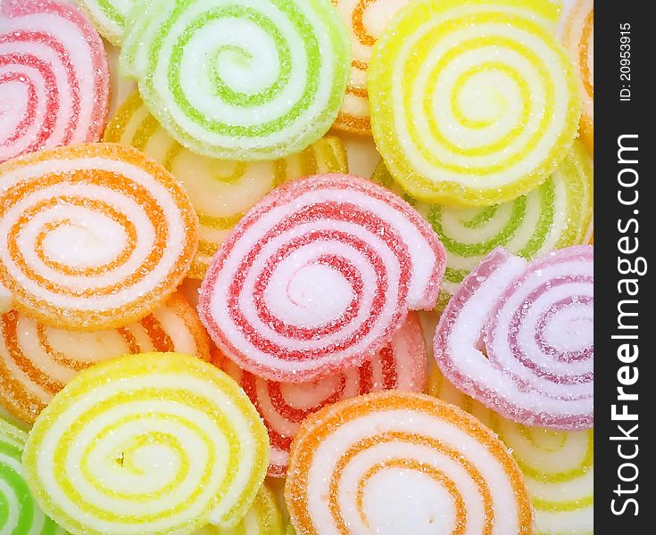 Close-up of colorful candy on white background.