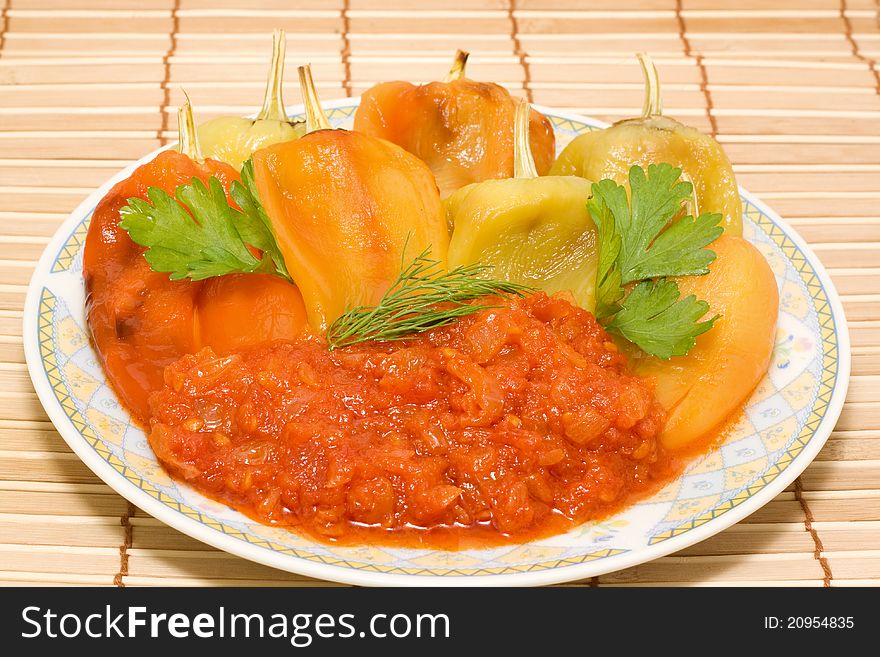 Roasted peppers and tomato sauce on a plate