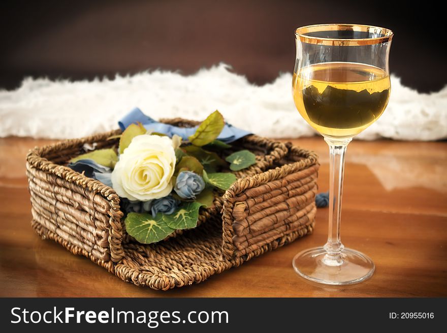 Glass of white wine on a wooden background. Glass of white wine on a wooden background