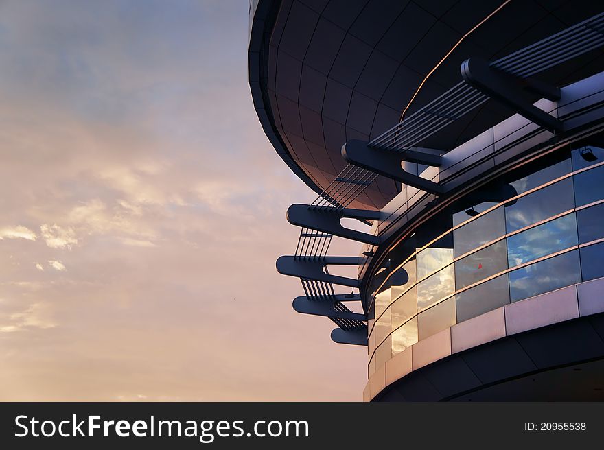 Pointy Futuristic Building reflecting bright red sunset