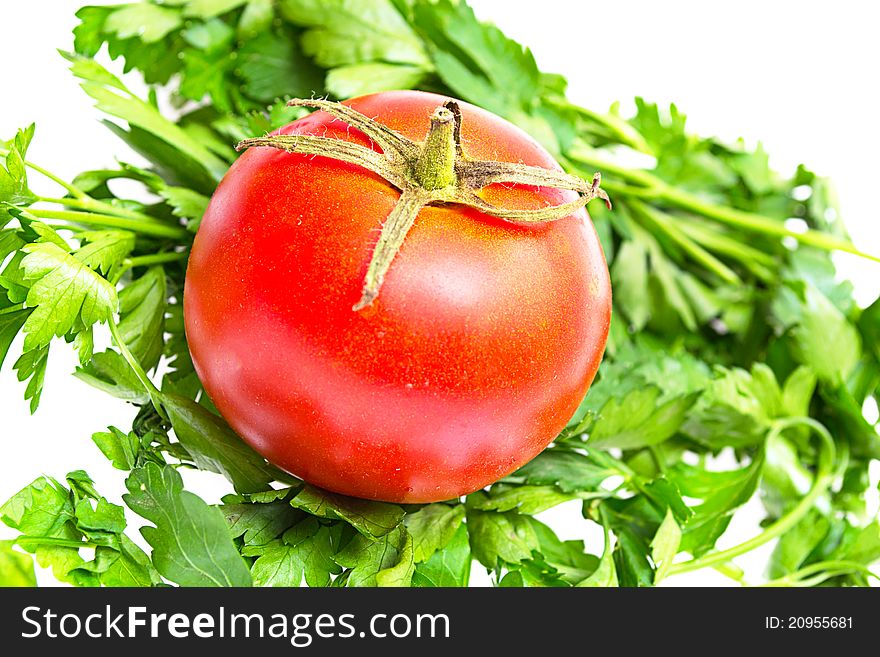 Fresh tomato and parsley on a white
