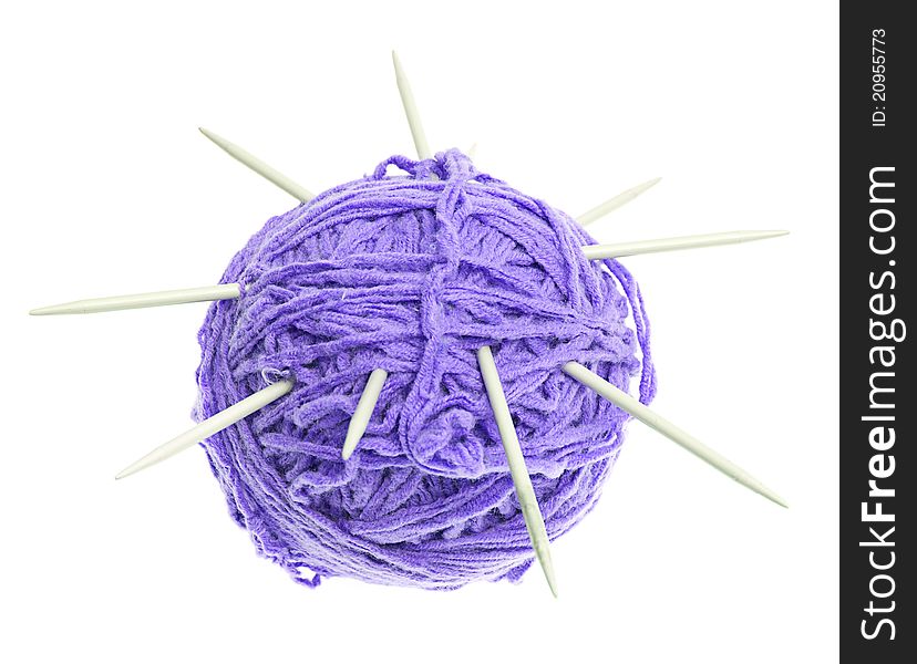 A ball of thread and knitting needles on a white background