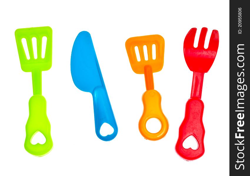 Plastic knife and fork, against a white background. Plastic knife and fork, against a white background