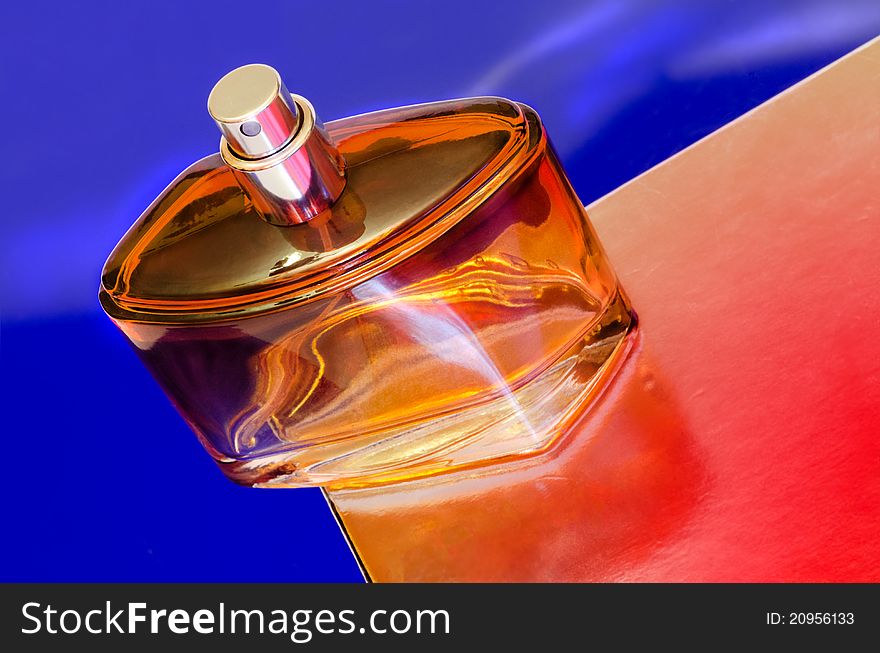 Perfume bottle on a colorful background.