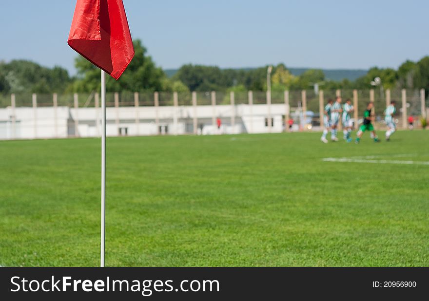 Red football flag in field