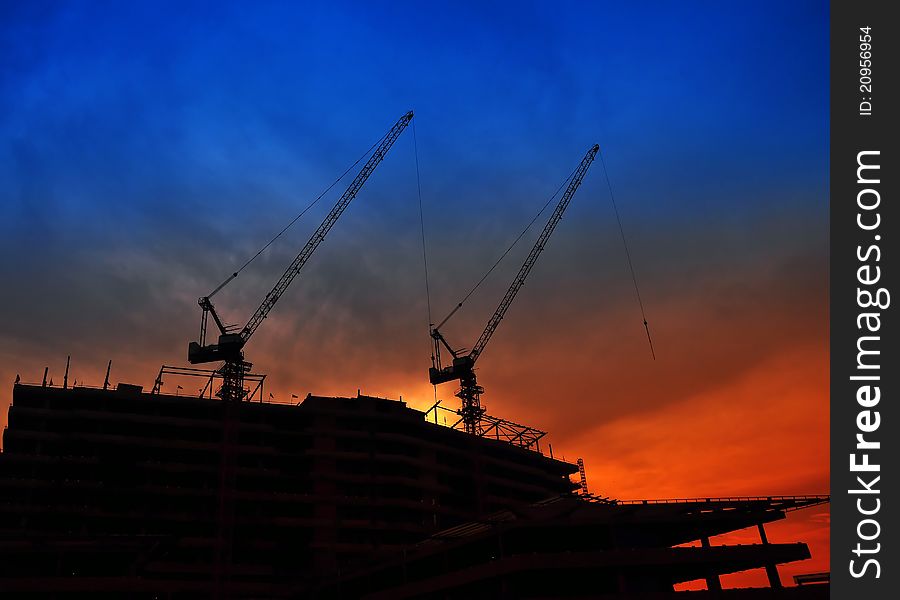 Crane Operating On Sunset