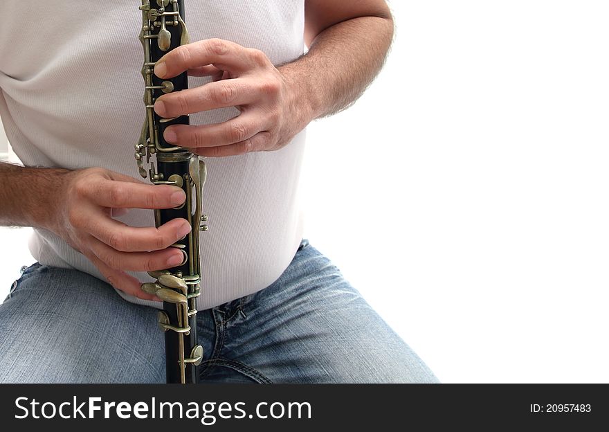 Closeup of a man playing clarinet over a white background. Closeup of a man playing clarinet over a white background