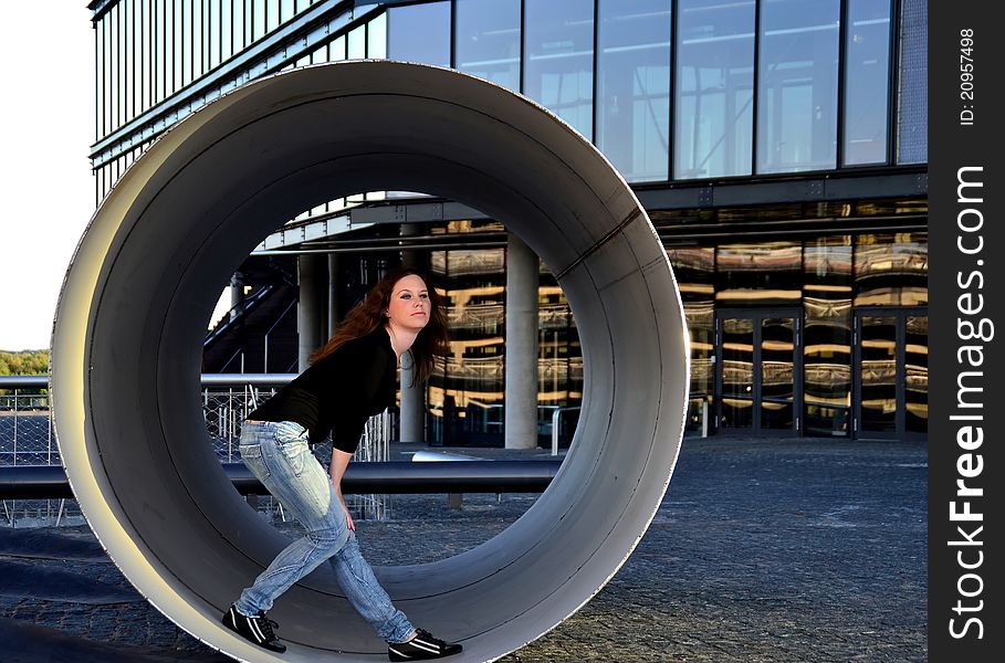 Girl standing inside the metallic pipe. Girl standing inside the metallic pipe