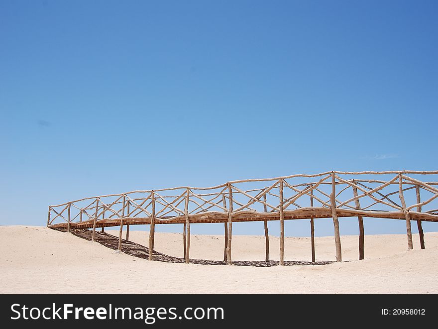 Wooden bridge at desert-island in Egypt. Wooden bridge at desert-island in Egypt.