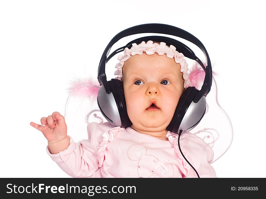 Cute baby with headphones on a white