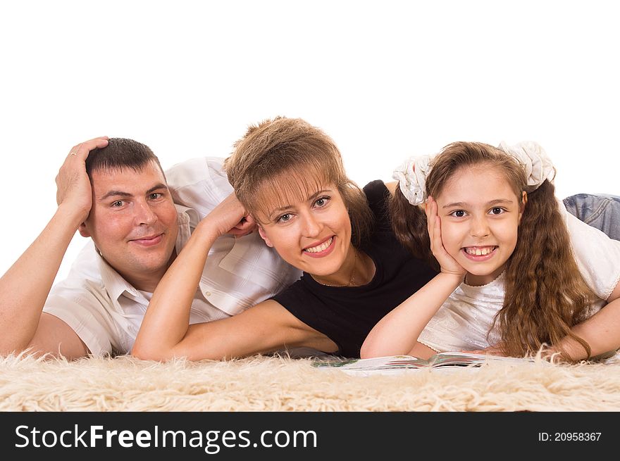 Cute family of a three lying on carpet. Cute family of a three lying on carpet
