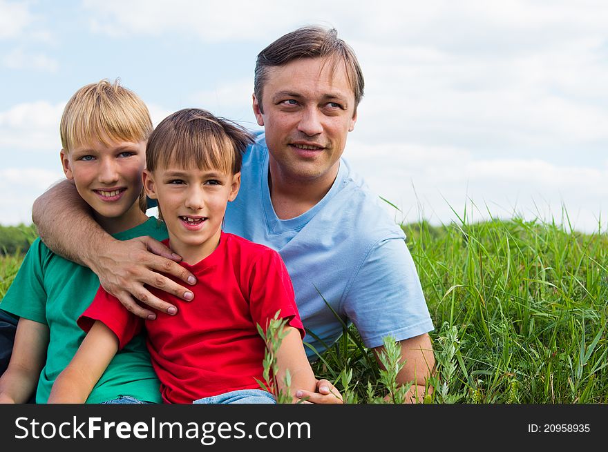 Dad With Sons At Field