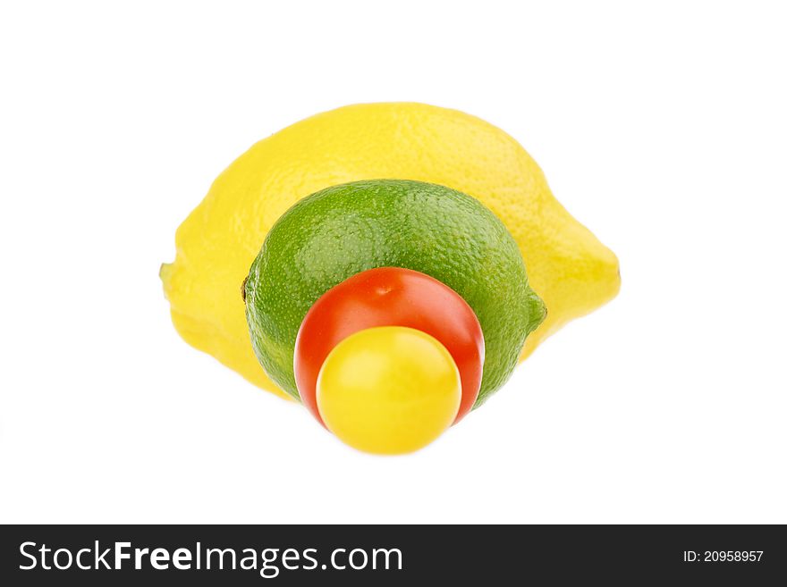 Fresh lemon lime and tomato isolated on white. Fresh lemon lime and tomato isolated on white