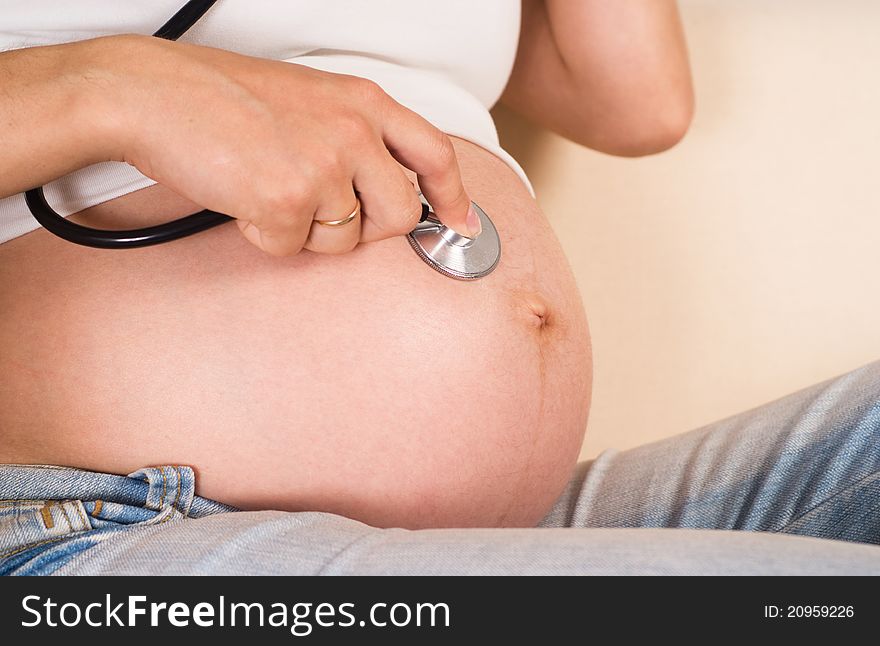 Pregnant Woman With Stethoscope