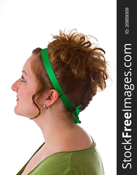 Young caucasian woman with an updo hair style on bright background