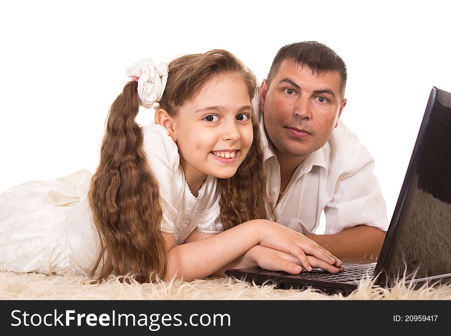 Portrait of a dad and daughter with computer