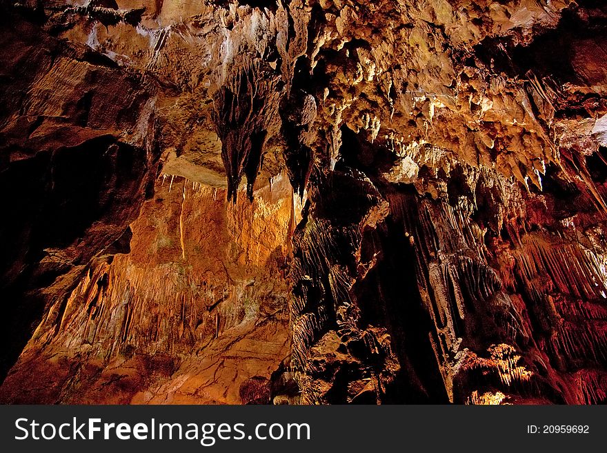 Cave interior with stalagmites and exotic colors