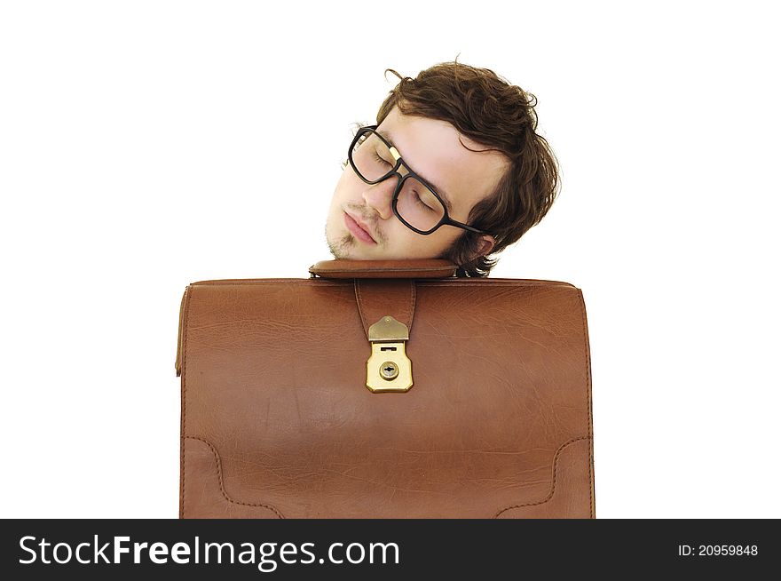 Modern tired businessman with glasses sleeping on the brown case. Isolated on the white background. Modern tired businessman with glasses sleeping on the brown case. Isolated on the white background.