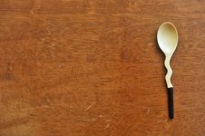 Spoon On Wood Stock Image
