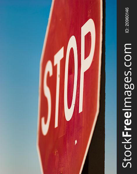 Close up view of Stop Sign shot with shallow depth of field. Close up view of Stop Sign shot with shallow depth of field.