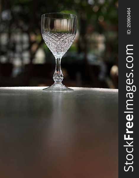 Crystal wine glass on the mirror table