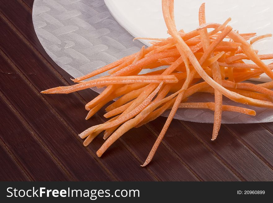 White rice paper and shredded orange carrots. White rice paper and shredded orange carrots.