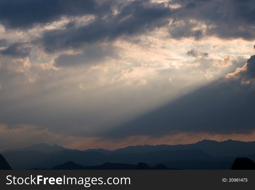 Amazing ray of sunlight and sky above Chinese mountain with horizon view. Yangshuo, China, Asia