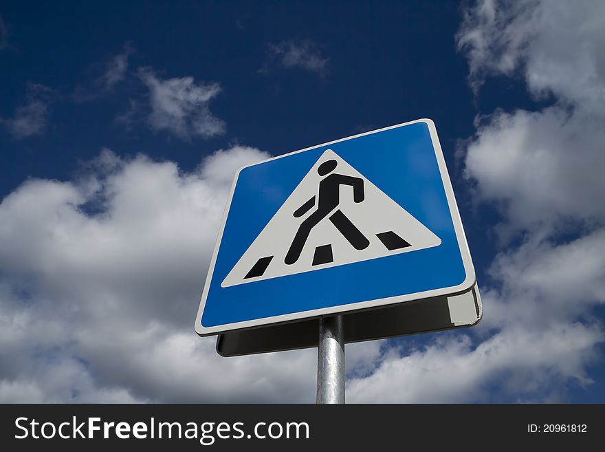 Crosswalk road sign on a sky background