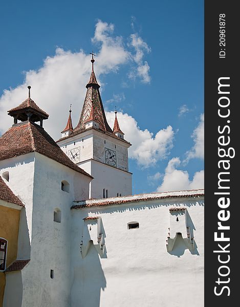 Fortified church of Harman in Romania. Tall white wall of a small fortified church in Transylvania