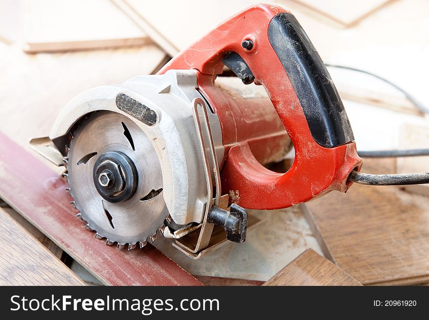 Circular saw sitting on board