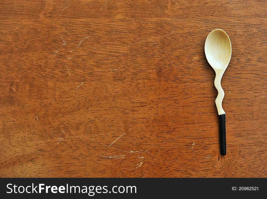 Wooden spoon on a damaged wooden table, so peaceful. Wooden spoon on a damaged wooden table, so peaceful.