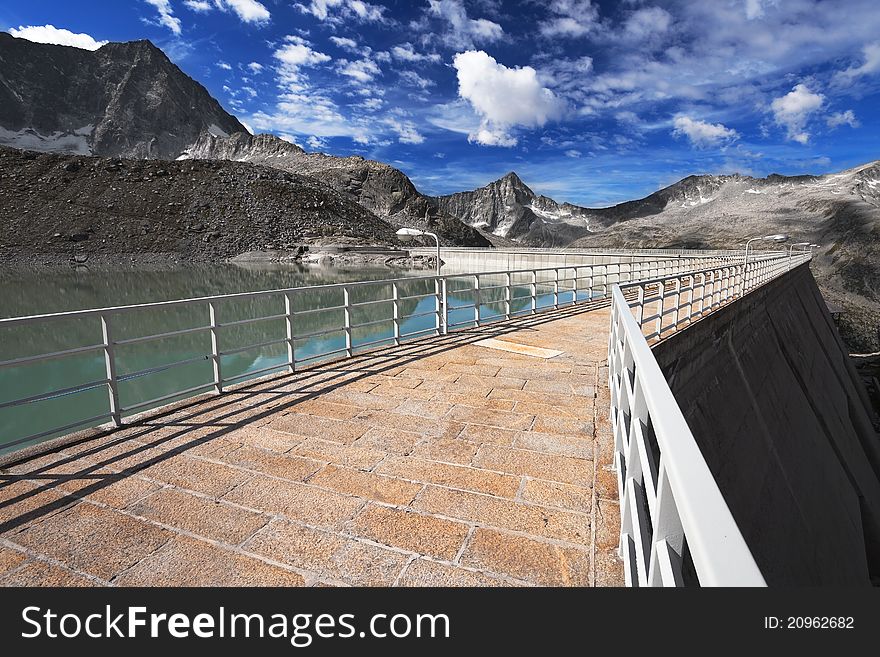 Dam and man-made lake between mountains. It’s Venerocolo Lake, North of Italy, Lombardy region, at 2.540 meters on the sea-level. Dam and man-made lake between mountains. It’s Venerocolo Lake, North of Italy, Lombardy region, at 2.540 meters on the sea-level